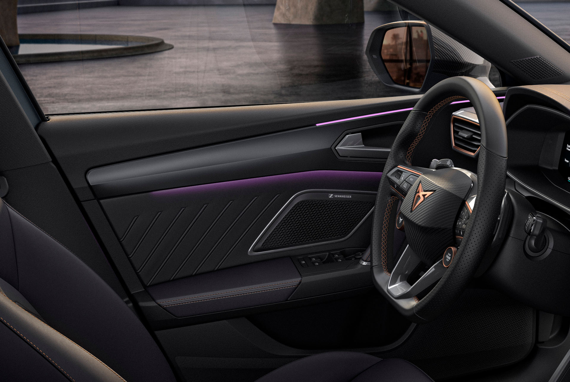primer pla del disseny interior del nou Cupra Leon Sportstourer 2025, volant, panell de la porta, il·luminació ambiental, logotip Cupra i finestreta