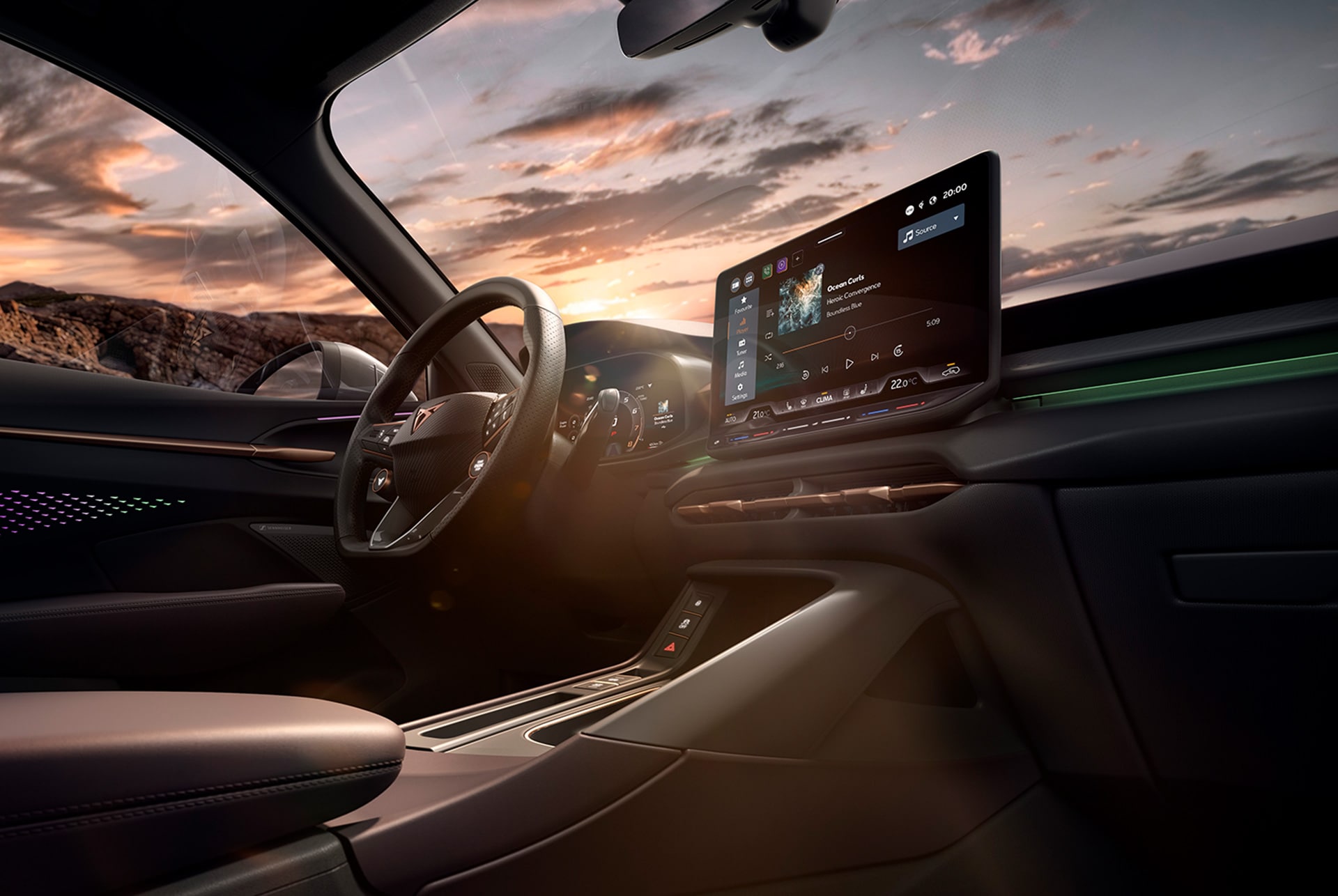 Nou interior del CUPRA Terramar amb sistema d'infotainment, lleves en el volant i quadre de comandament amb detalls en coure.