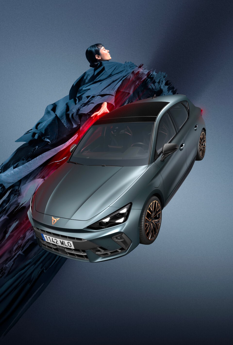 three quarter front view of new cupra Leon 2024 in Enceladus grey and architectural structure, parked on smooth cement, backdrop of Barcelona cityscape